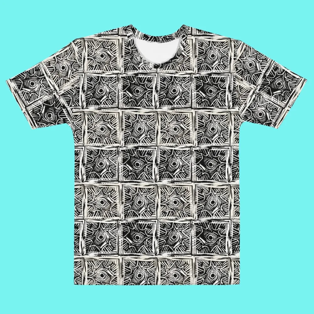 All-over-print tee in black and cream, tiling a hand-carved linoleum block motif of concentric eyes inside squares