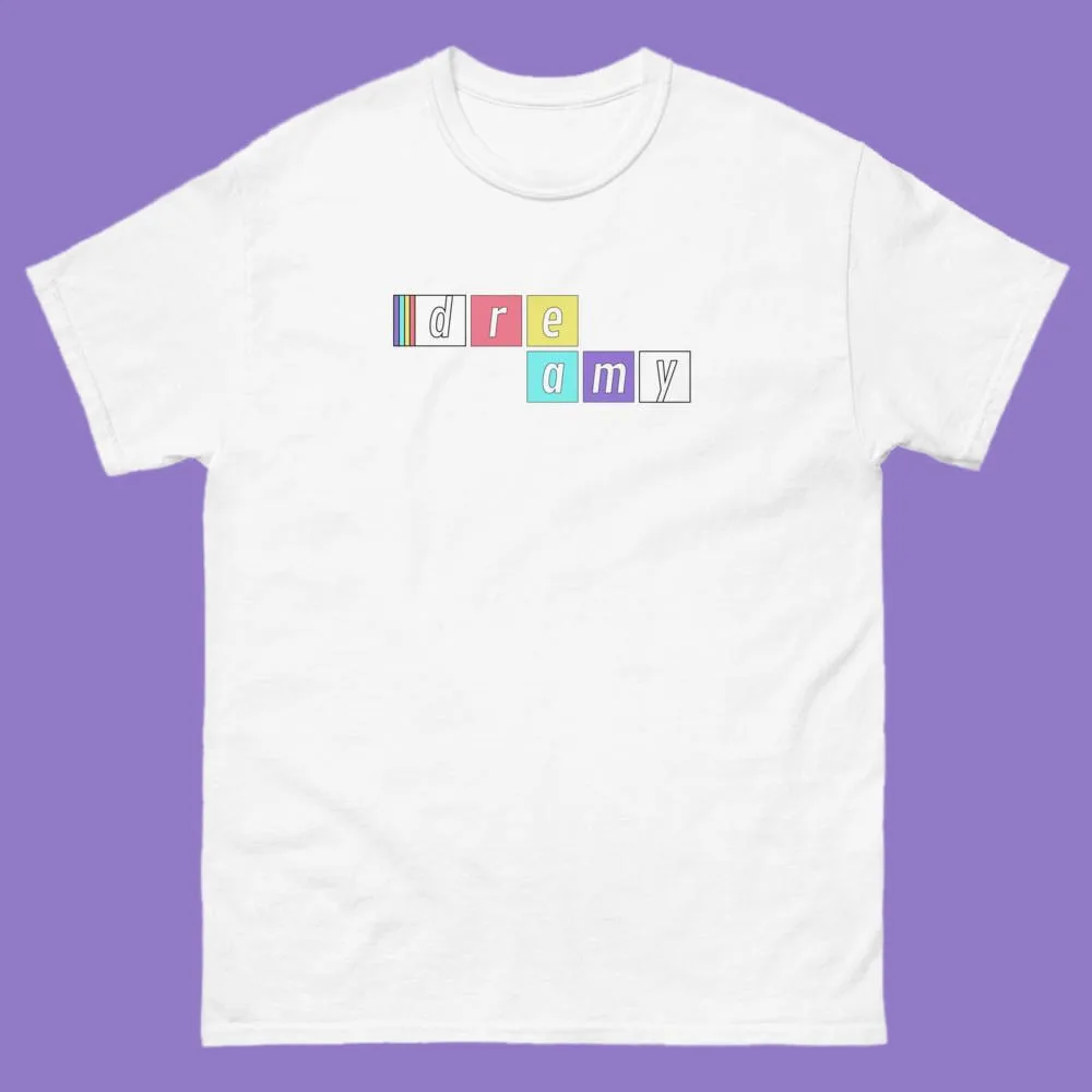 White tee with dreamy spelled across pastel letter tiles in two offset rows