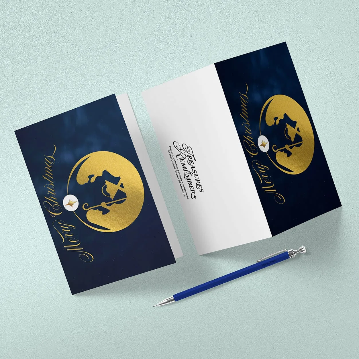 Navy and gold Christmas card showing a Nativity silhouette in a gold circle, displayed closed and open