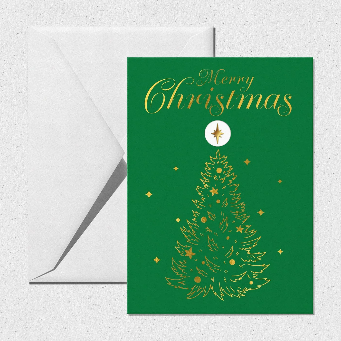 Green Christmas card with a gold foil line-drawn tree topped by the gold star