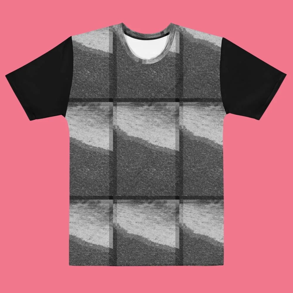 Black-sleeved tee tiling a grainy monochrome photograph of a shoreline into a three-by-three grid