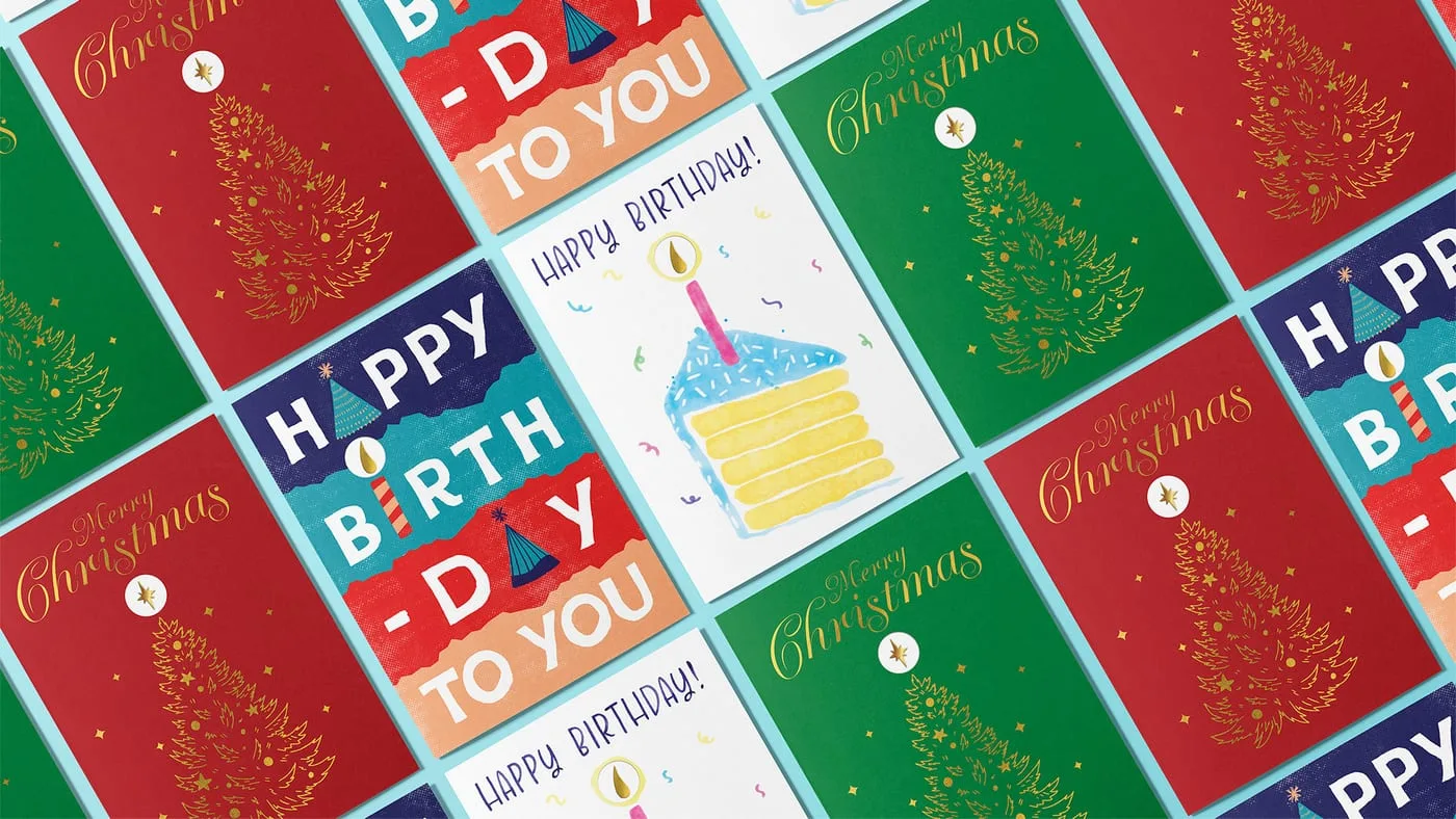 The card range laid out as a diagonal grid, showing the Christmas and birthday designs side by side