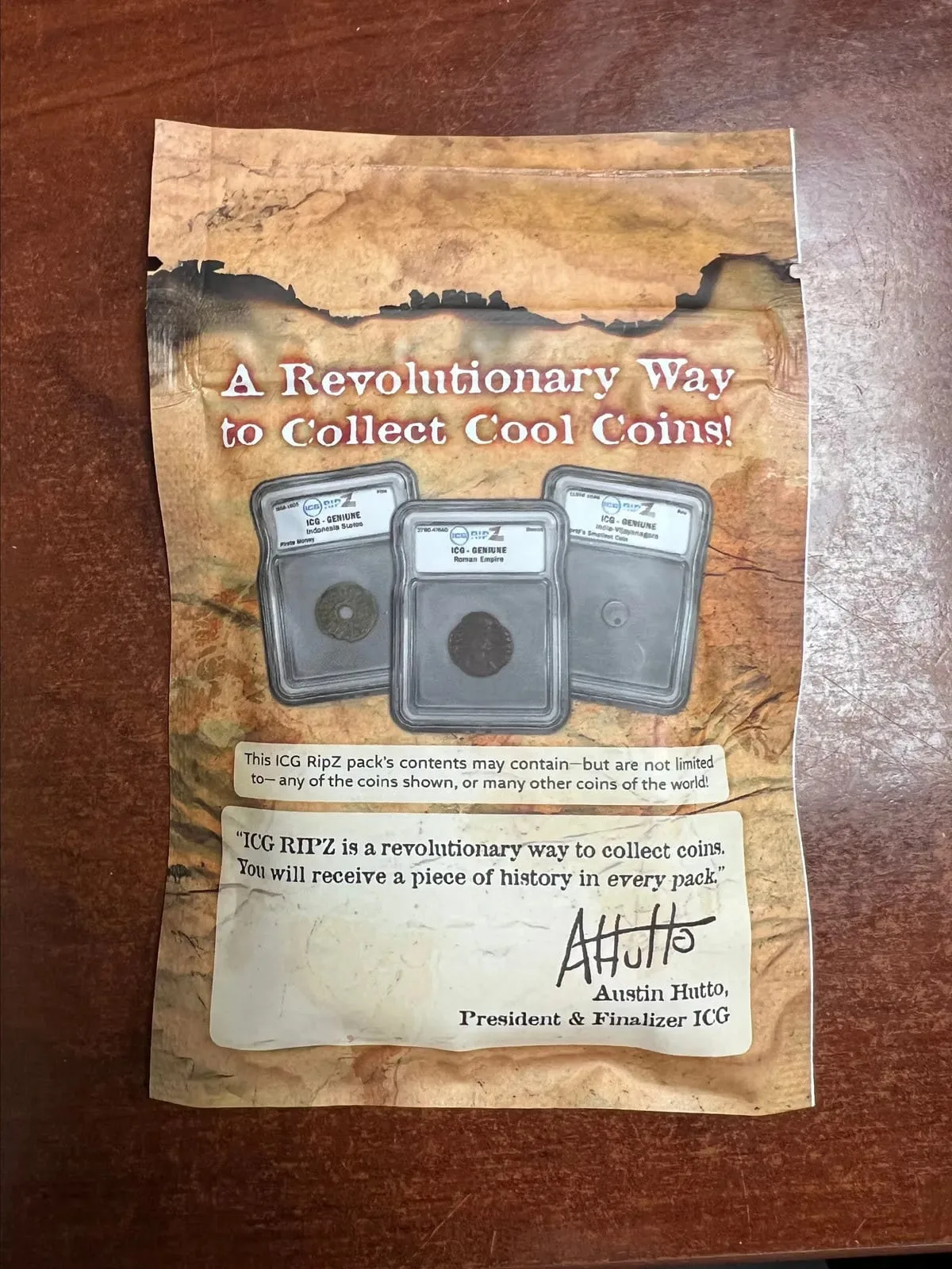 Reverse of the mystery pack, three slabbed sample coins above a contents note and an endorsement