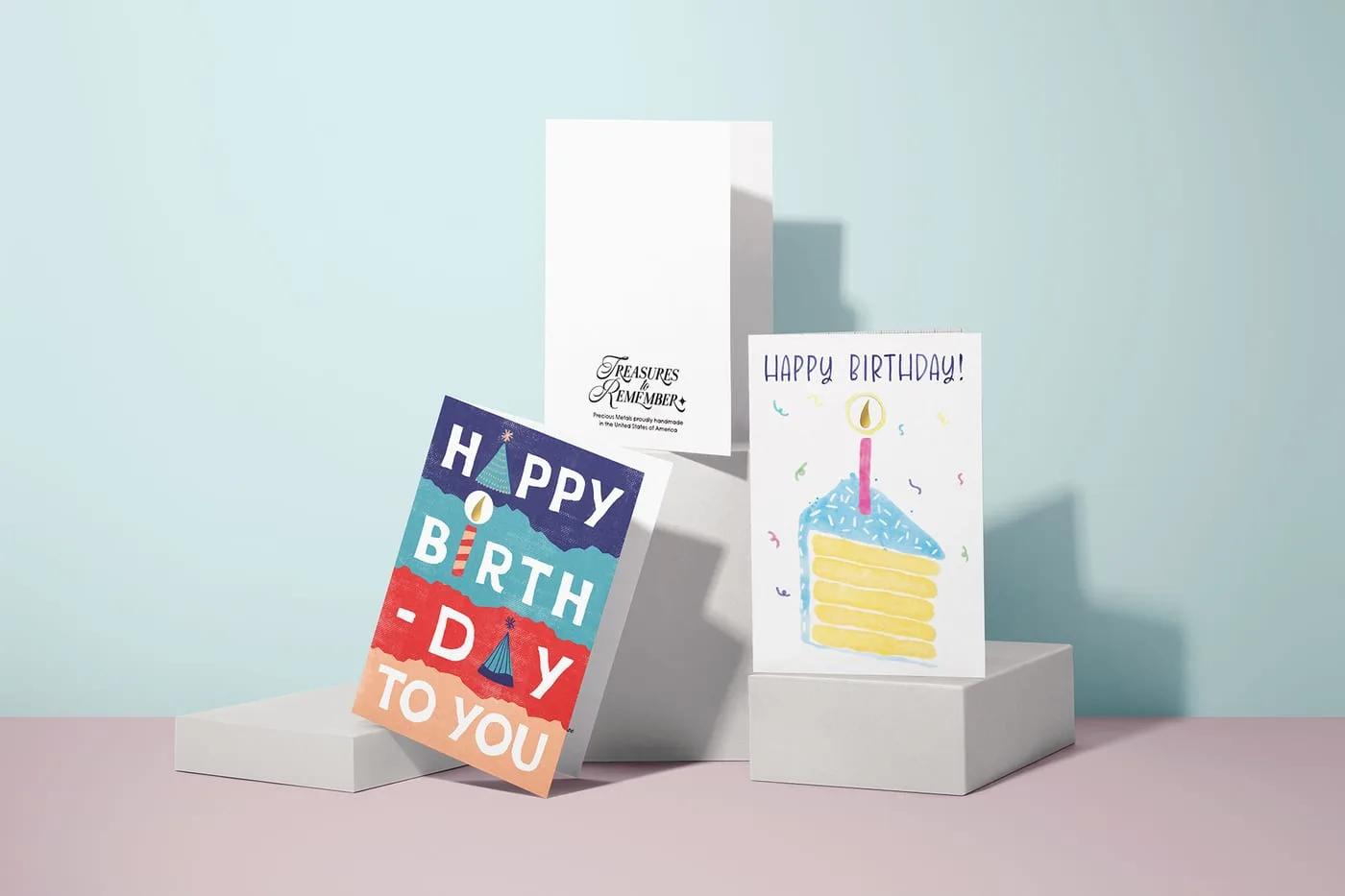 Birthday range shot showing both cover designs alongside the inside of a card carrying the brand logo
