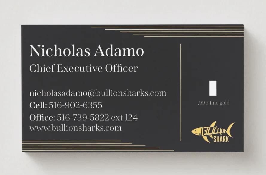 Charcoal and gold business card for the company's chief executive, gold keyline rules bracketing the type with a fine gold bar inset beside the logo